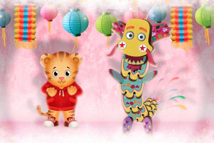 Daniel makes believe the dancing dragon comes alive and they sing and  dance together.  