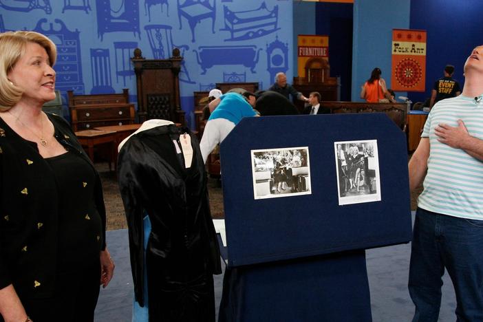 Beth Szescila appraises a Marilyn Monroe dress from "Some Like it Hot." 