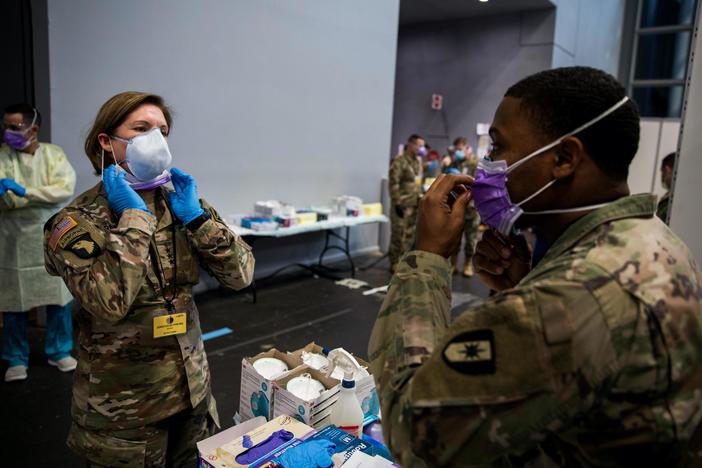 U.S., global officials weigh risks of easing COVID-19 restrictions