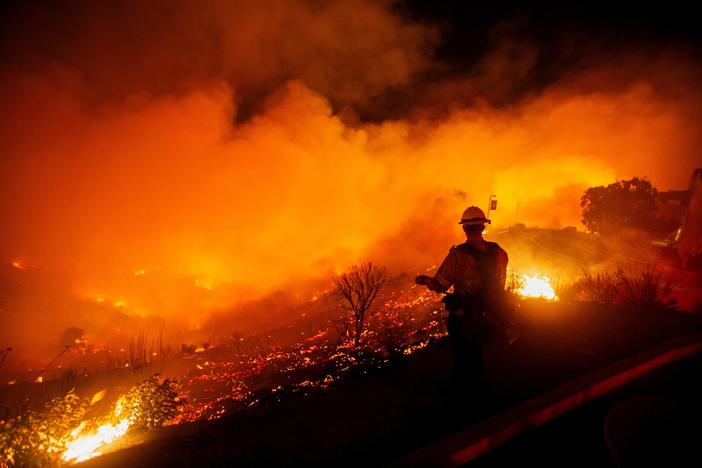 News Wrap: Wildfire near Malibu explodes in size overnight