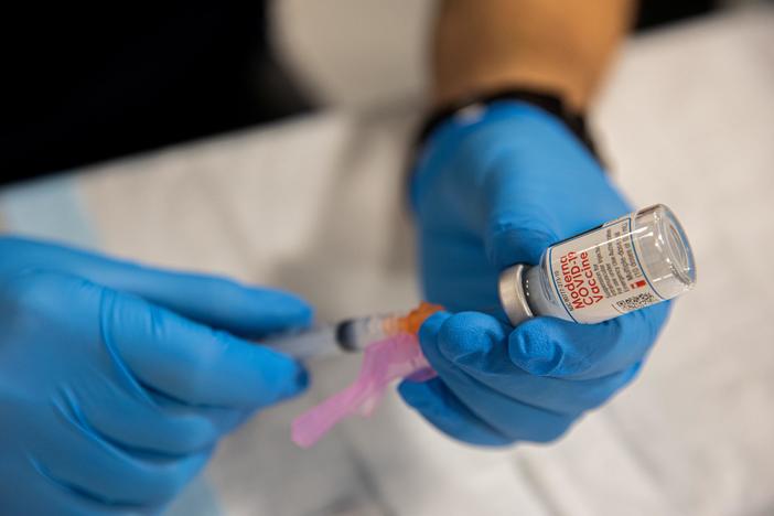 News Wrap: Biden invokes Defense Production Act to ramp up supply of COVID-19 vaccines