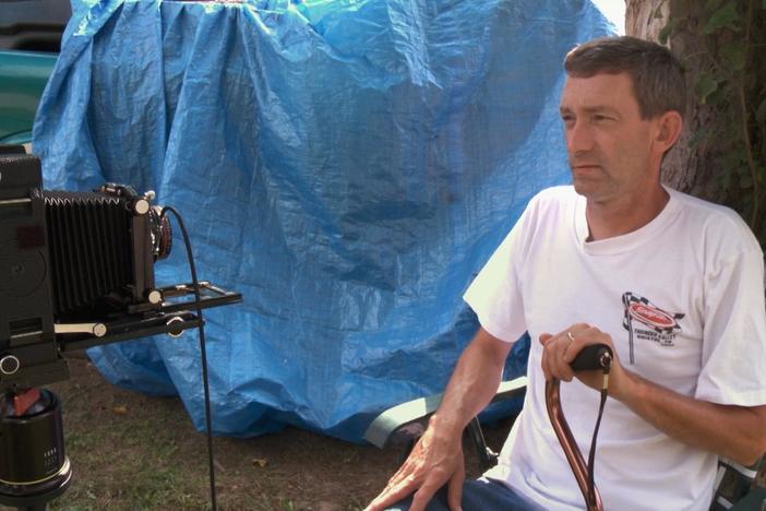 We see a series of Johnny’s family portraits and hear him reflect about his childhood.