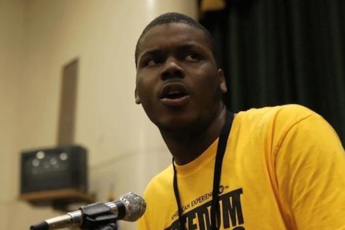 Student freedom rider Michael Tubbs speaks to students at Jim Hill High School.