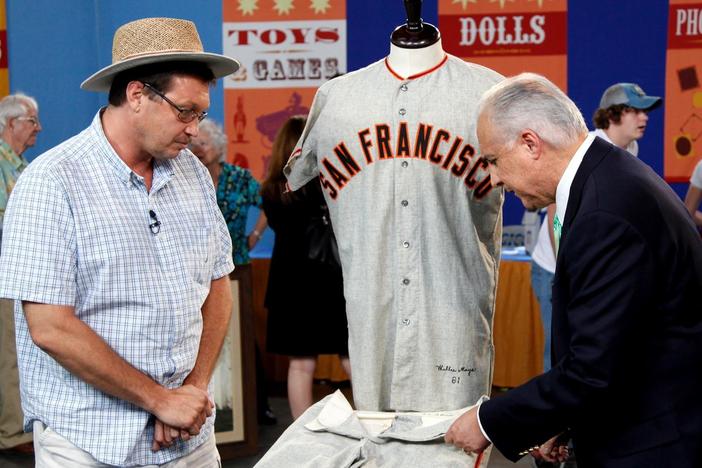 Mike Gutierrez appraises a complete Willie Mays away uniform in excellent condition.
