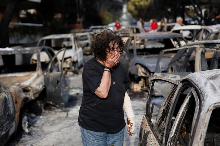 News Wrap: Fast-moving Greek wildfires kill dozens