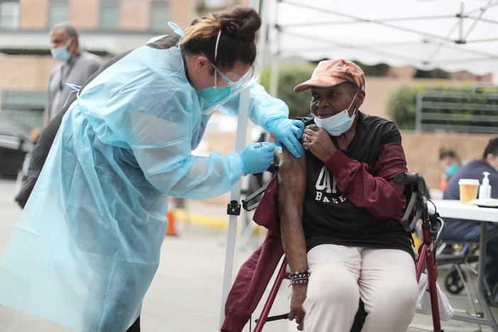 News Wrap: Average daily COVID-19 infections in the U.S. fall below 100,000