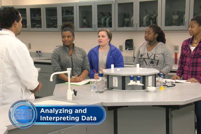 The teacher discusses the behavior of gases at the macro and molecular level.