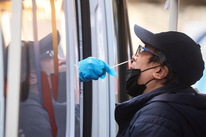 News Wrap: WHO says global COVID-19 cases drop by nearly a quarter
