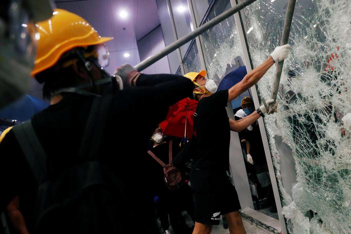 Hong Kong protesters storm buildings, clash with police