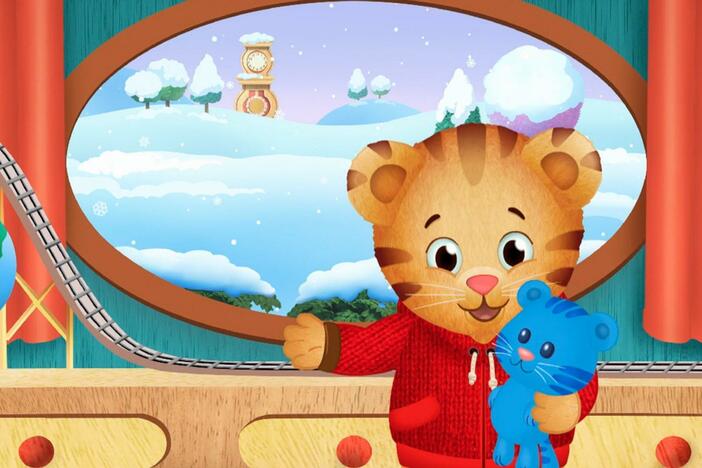 Daniel makes believe he is playing with the stuffed animals outside in the snow.