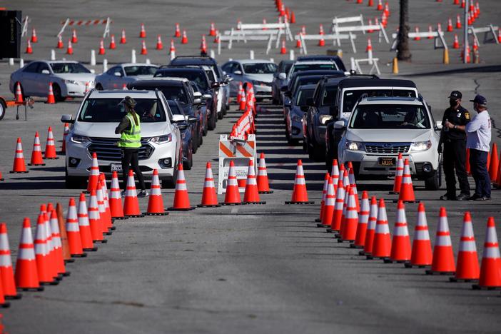 News Wrap: As Biden takes office, U.S. death toll from COVID-19 reaches 403,000
