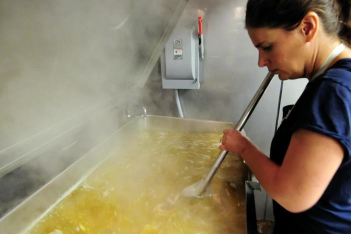 Vivian prepares her mother's chicken and rice dish.