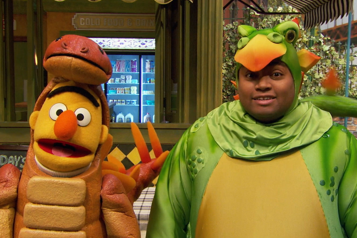 Elmo, Chris, and their friends on Sesame Street have dressed up as dinosaurs.