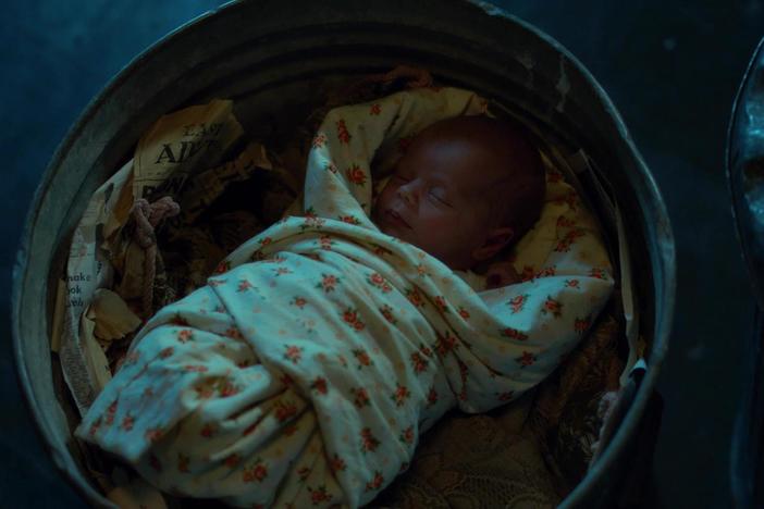 Fred finds an abandoned baby in a dustbin.