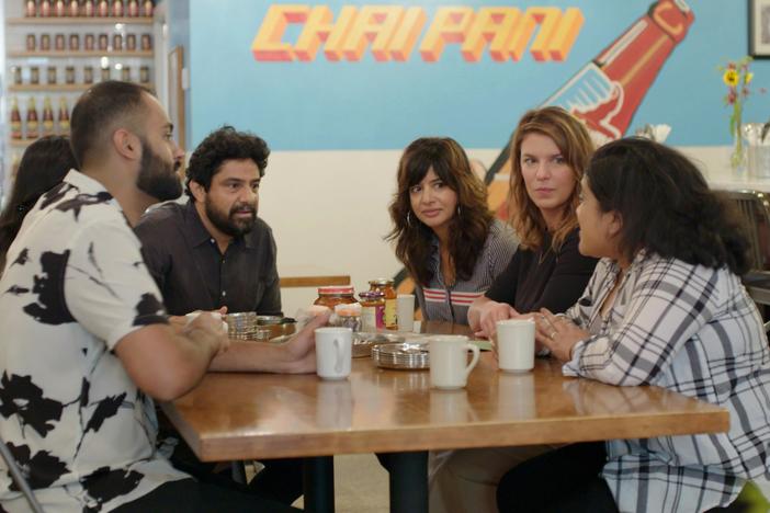 Chefs explain Indian pickle traditions to Vivian Howard while sampling a variety.