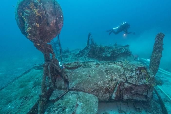 Dive beneath the sea to the wreckage of a WWII bomber.