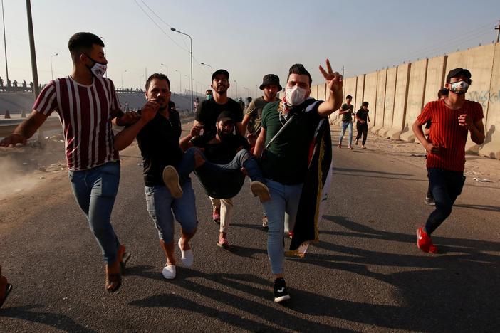 News Wrap: Iraqi security forces kill at least 12 more protesters