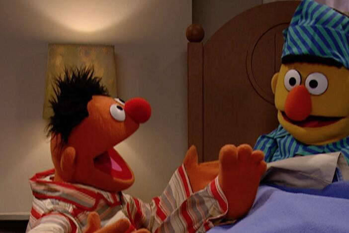 Ernie sings about how much he loves his toes.