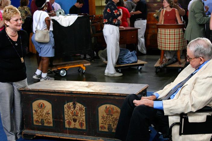 Wendell Garrett appraises a Pennsylvania-German dowry chest, ca. 1974. 