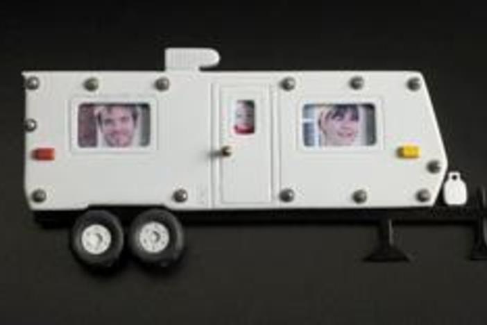 Tom, Athene & newborn Charlotte Paquin lived in a FEMA trailer while repairing their home.
