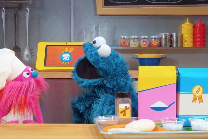 Cookie Monster and Gonger learn how to make a pie.