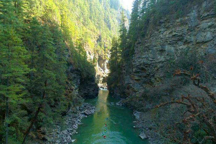 Expedition cameraman James Covington runs the Chamkachu River.