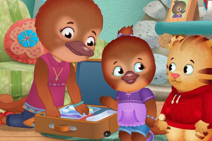 Jodi and Daniel help Dr. Plat pack her suitcase for a trip away from home.