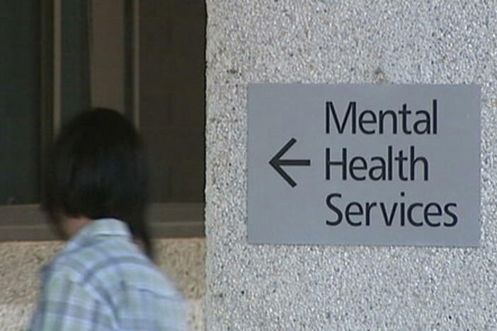A person walks into a mental health clinic.