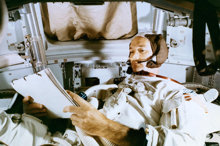 Collins studies the flight plan during simulation training at the Kennedy Space Center before the scheduled Apollo 11 mission.
