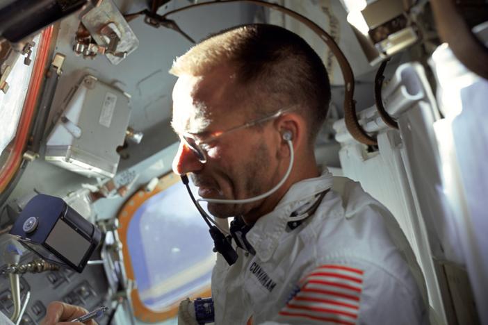 Lunar module pilot Walt Cunningham performs flight tasks on the ninth day of the Apollo 7 mission in 1968.