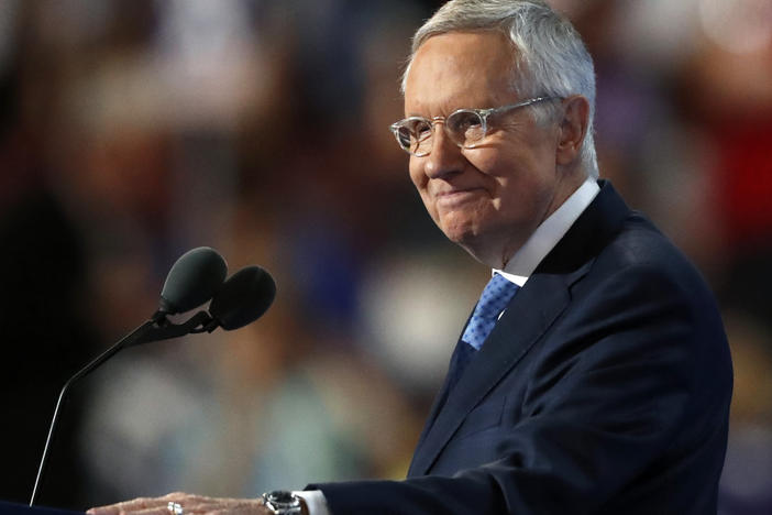 Then-Senate Minority Leader Harry Reid of Nevada smiles as he speaks during the third day of the Democratic National Convention in Philadelphia on July 27, 2016.