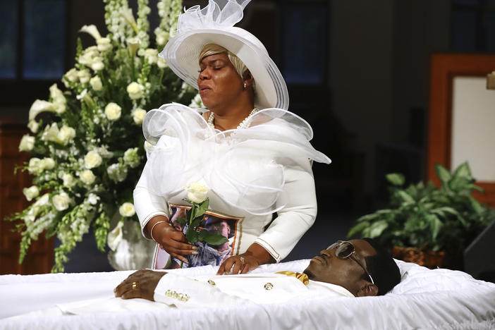 Tomika Miller weeps over her husband Rayshard Brooks as his coffin is closed at the conclusion of his public viewing at Ebenezer Baptist Church in Atlanta on Monday.