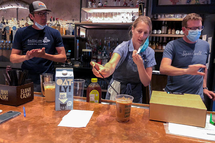 Lauren Moran, a pastry chef who owns a bakery and café, taste-tests Cornwall's new coffee drinks with her husband, Cornwall's general manager Billy Moran (left), and Speedwell Coffee Co. owner Derek Anderson.