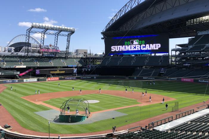 Seattle Mariners players are gearing up for the start of a shortened regular season. At their home ballpark, summer training is underway this week with strict coronavirus restrictions.