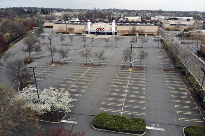 Movie chains are suing to be included in New Jersey's reopening plans. An empty parking lot is seen at an AMC movie theater in Clifton, N.J, on April 5.