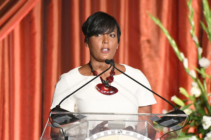 Atlanta Mayor Keisha Lance Bottoms, shown here in 2019, says a headache is her only symptom after testing positive for the coronavirus.