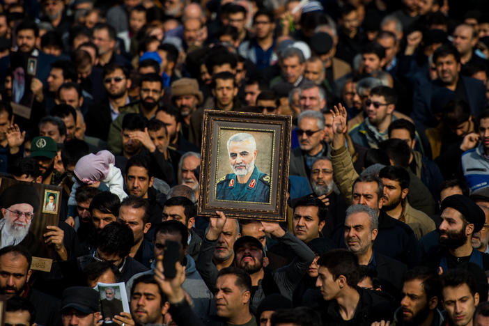 The U.S. killed Iranian Maj. Gen. Qassem Soleimani in a targeted drone strike in Baghdad. A U.N. investigator says the action violated Iraq's sovereignty. Here, protesters in Tehran, Iran, hold up an image of Soleimani during a demonstration on Jan. 3.