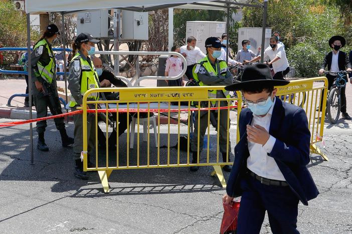 Israeli security forces control access to a neighborhood that has been isolated following an increase in coronavirus cases in the southern coastal city of Ashdod last week.
