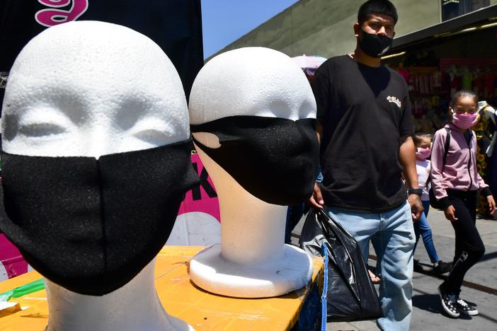 Face coverings are seen on display in Los Angeles on July 2. California Gov. Gavin Newsom threatened this week to withhold up to $2.5 billion in aid to local police departments that refuse to enforce mask rules and other pandemic-related mandates.