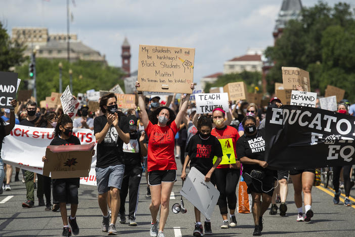 Black Students Matter demonstrators march en route to a rally at the Department of Education in Washington, D.C., on June 19.