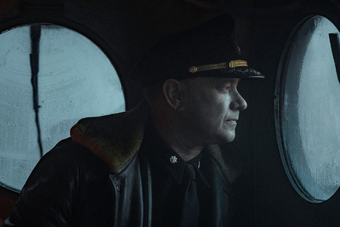 Captain Krause (Tom Hanks) looks astern in <em>Greyhound</em>.