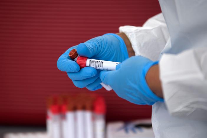 A health care worker organizes coronavirus tests that were administered at a United Memorial Medical Center testing site in Houston on June 25.
