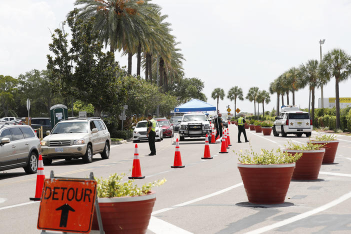 Cars line up for drive-through coronavirus testing in St. Petersburg, Florida. The state reported a record-breaking 15,299 new cases on Sunday.