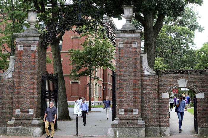 Pedestrians in Harvard Yard in 2019. Schools and businesses have gone to court to stop the Trump administration from barring online-only international students from entering or staying in the United States.