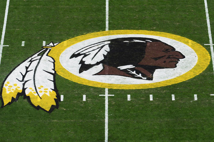 The Washington Redskins' logo is seen before a game in 2019 in Landover, Md. The Redskins have announced the team will be dropping its moniker, which is widely considered a slur against Native Americans.