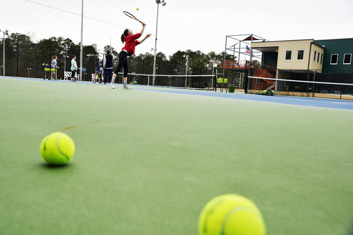 Sarah Rogers serves to Kyra Moodie, a fellow student in an all home school student tennis practice, at the John Drew Tennis Center recently. Macon-Bibb has put a lot of money into recreational tennis.