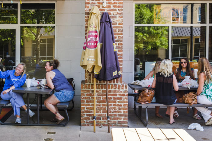 Diners outside a Mexican restaurant near Mercer University in Macon were separated by a brick pillar and a few feet Tuesday. 