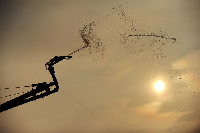 An agricultural irrigator fueld by the Flint River waters down a peanut field near Colquitt during a drought in 2011. 