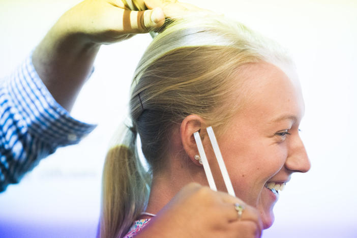 McKinley Cranford takes a basic hearing test with a tuning fork during the Mercer University Medical School tour.