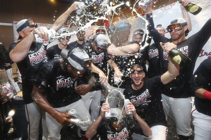 Atlanta Braves bullpen pitchers celebrate after clinching the NL East baseball title with a victory over the San Francisco Giants, Friday, Sept. 20, 2019, in Atlanta.